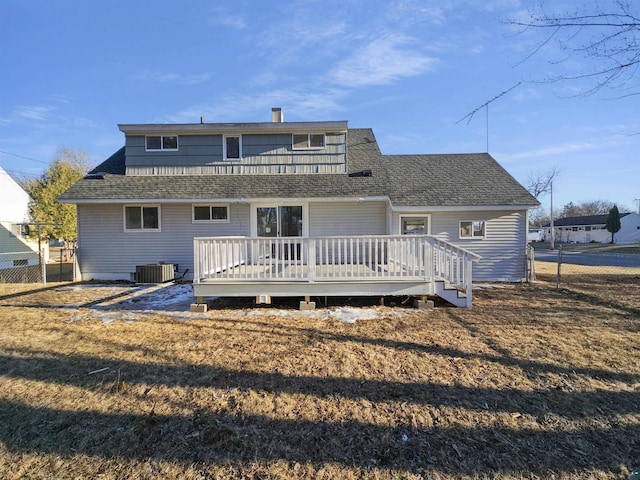 back of house featuring central air condition unit, a wooden deck, fence, and roof with shingles