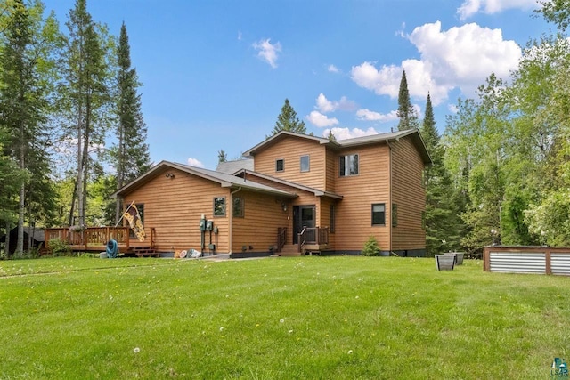 2755 County Road 1, Wrenshall, MN 55797 - back of property featuring a wooden deck and a lawn