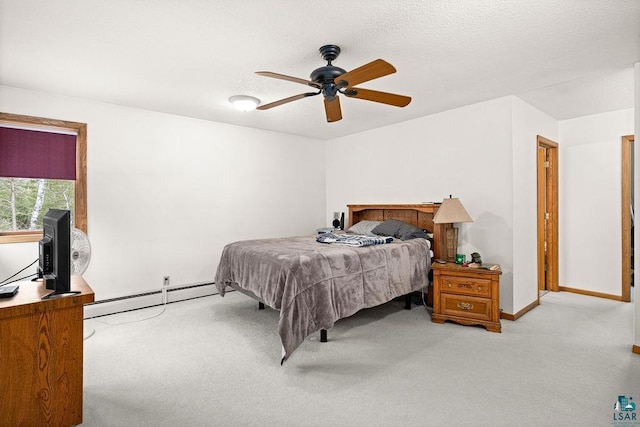 2755 County Road 1, Wrenshall, MN 55797 - carpeted bedroom featuring baseboards, a baseboard heating unit, a ceiling fan, and a textured ceiling
