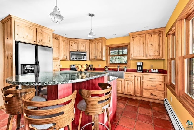 kitchen featuring a baseboard heating unit, a sink, stainless steel microwave, refrigerator with ice dispenser, and electric range