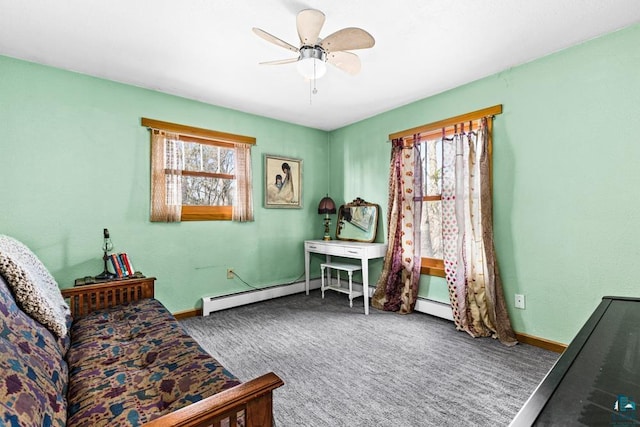 sitting room with ceiling fan, baseboards, and carpet
