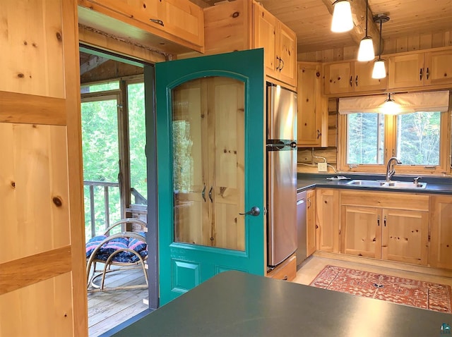 8352 Old Gunflint Trl, Grand Marais, MN 55604 - kitchen featuring a sink, appliances with stainless steel finishes, dark countertops, light brown cabinetry, and wood ceiling