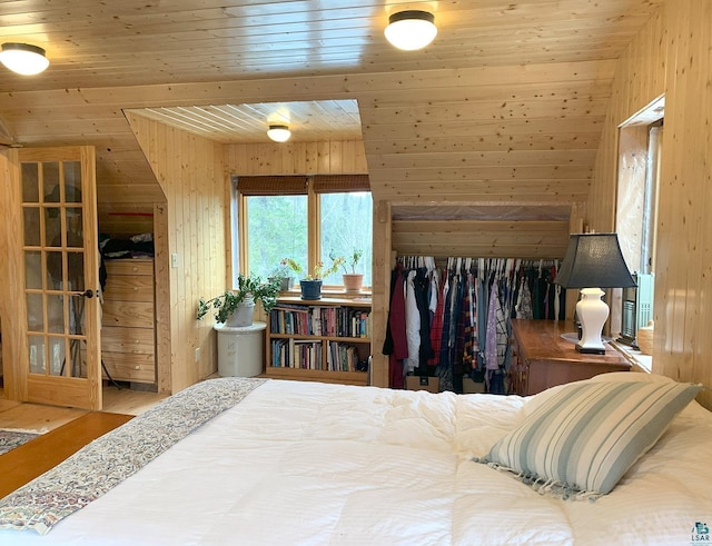 8352 Old Gunflint Trl, Grand Marais, MN 55604 - bedroom featuring wood walls and wood ceiling