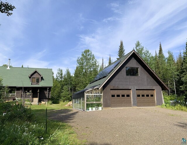 8352 Old Gunflint Trl, Grand Marais, MN 55604 - view of side of home with an outbuilding and a detached garage