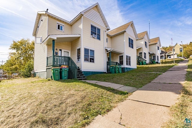 view of front facade with a front yard and a residential view