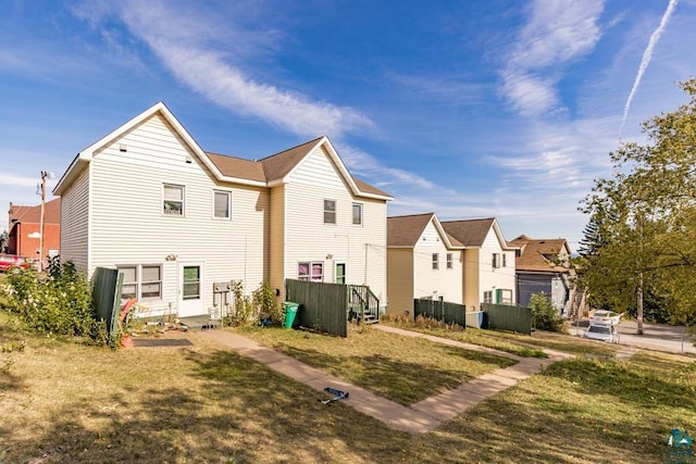 exterior space with a residential view and a lawn
