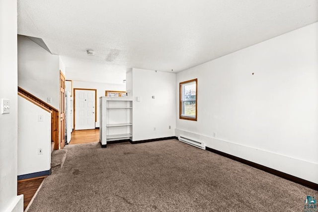 unfurnished living room with dark colored carpet, a baseboard radiator, and baseboards