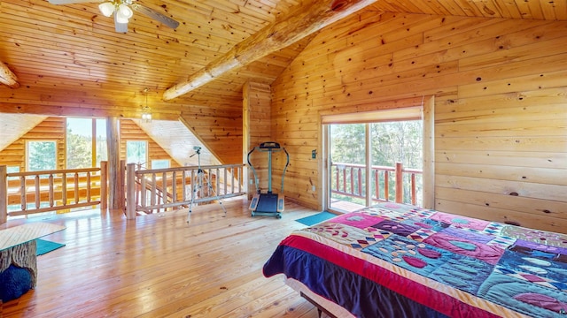 bedroom with lofted ceiling with beams, wooden ceiling, access to outside, and multiple windows