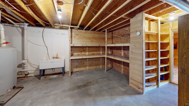 unfinished basement with wooden walls and a sink