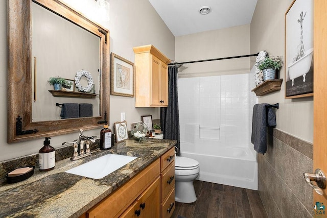 bathroom with shower / bath combination with curtain, wood finished floors, visible vents, toilet, and vanity