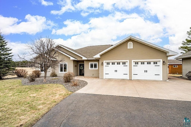 ranch-style home with an attached garage, a front lawn, and concrete driveway