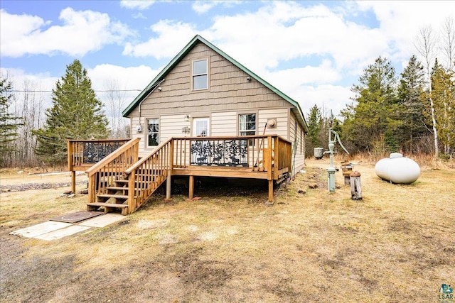 back of property featuring a wooden deck