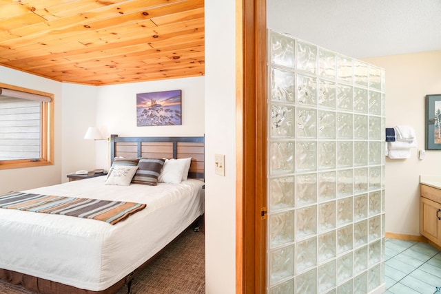 bedroom with wooden ceiling and light tile patterned floors