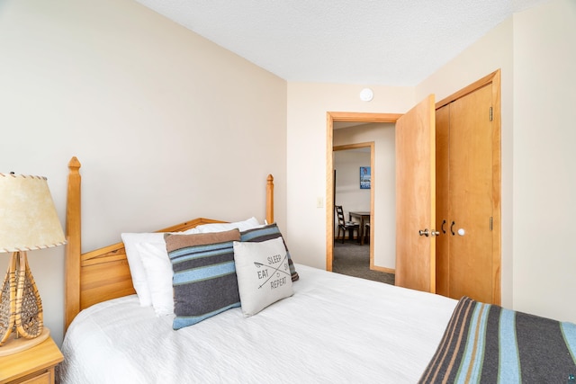 carpeted bedroom featuring a closet