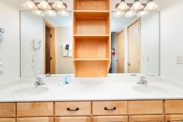 full bathroom featuring a sink and double vanity