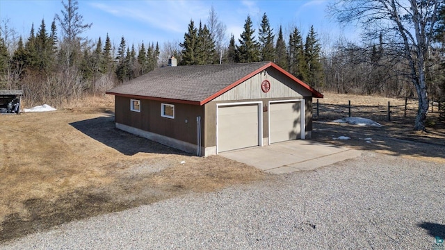 detached garage with fence