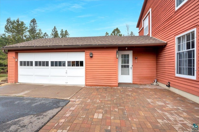 garage with aphalt driveway
