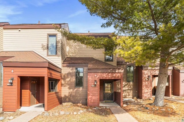 view of front of home featuring roof with shingles