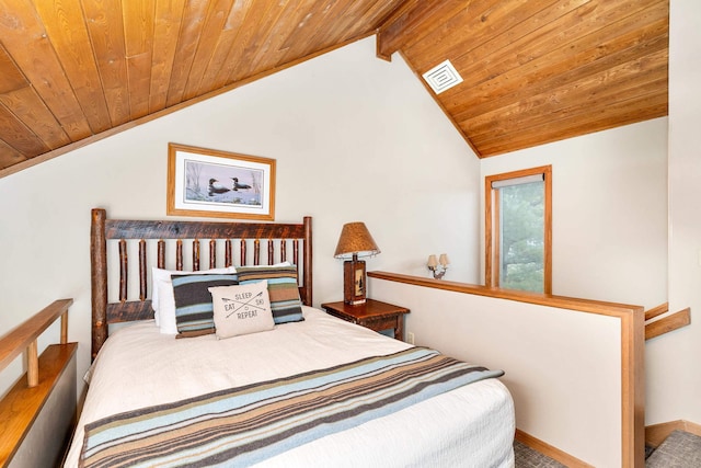 bedroom with lofted ceiling with beams, wooden ceiling, visible vents, and carpet flooring