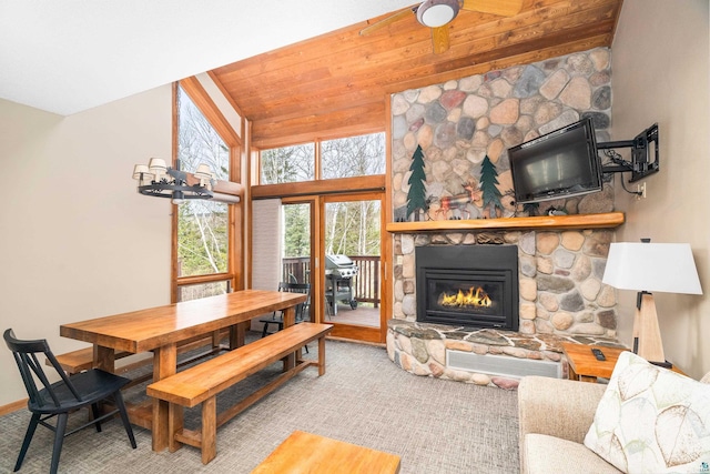 living area with a fireplace and ceiling fan