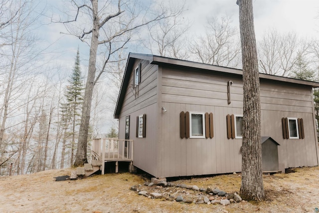 view of home's exterior featuring a wooden deck