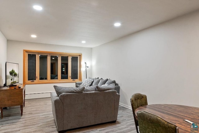 64 Hays Crk, Silver Bay, MN 55614 - living area featuring a baseboard heating unit, light wood-style flooring, baseboards, and recessed lighting