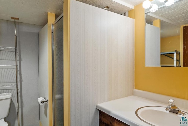64 Hays Crk, Silver Bay, MN 55614 - bathroom with vanity, a shower with shower door, and toilet