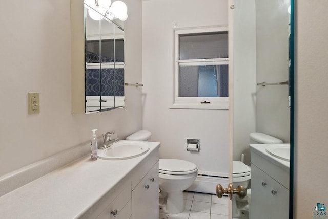 64 Hays Crk, Silver Bay, MN 55614 - bathroom featuring tile patterned floors, vanity, a baseboard radiator, and toilet