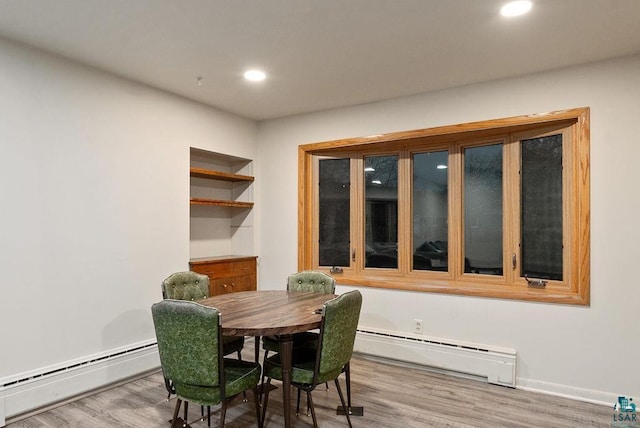 64 Hays Crk, Silver Bay, MN 55614 - dining space with a baseboard radiator, wood finished floors, and recessed lighting