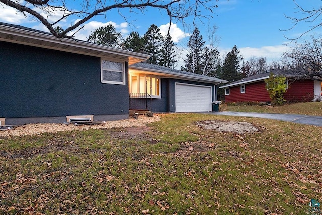 64 Hays Crk, Silver Bay, MN 55614 - view of front of property with a garage, driveway, and a front lawn