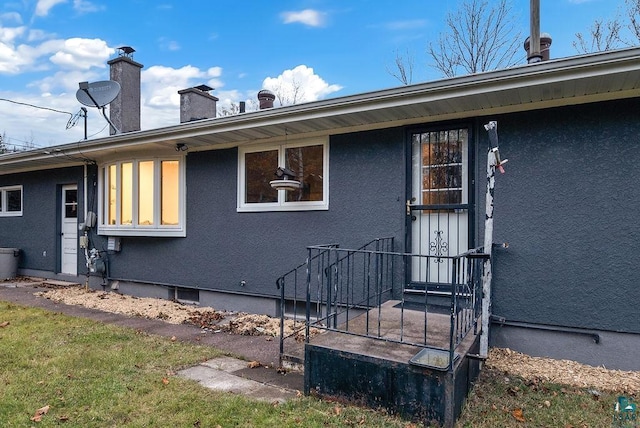 64 Hays Crk, Silver Bay, MN 55614 - exterior space with a chimney and stucco siding