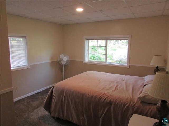 bedroom featuring carpet and baseboards