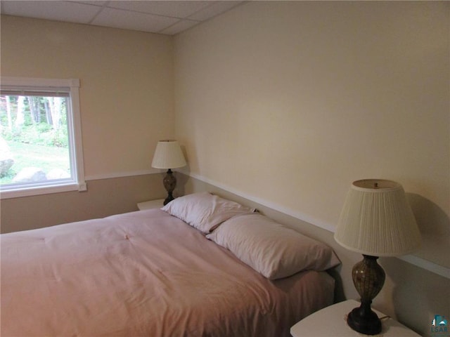 bedroom featuring a drop ceiling