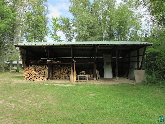 view of pole building with a lawn