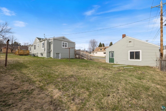 view of yard featuring stairway and a deck