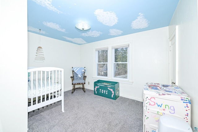 bedroom featuring carpet floors, baseboards, and a crib
