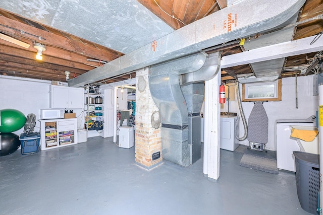unfinished basement featuring heating unit