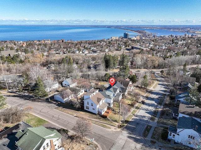 aerial view with a residential view and a water view