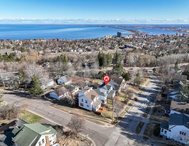 bird's eye view featuring a water view and a residential view