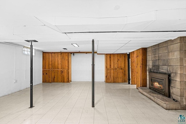 below grade area featuring a large fireplace