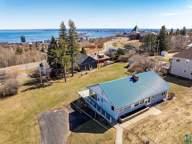 birds eye view of property with a water view