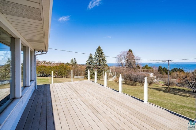 wooden deck with a lawn