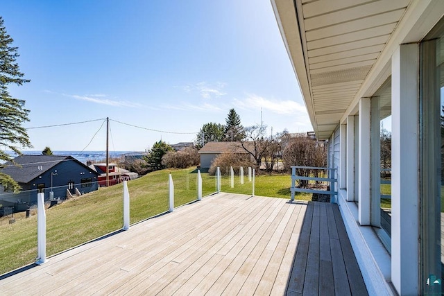wooden deck with a lawn