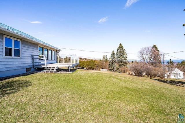 view of yard featuring a wooden deck