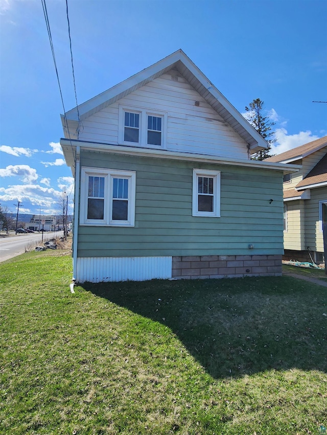 view of property exterior featuring a yard