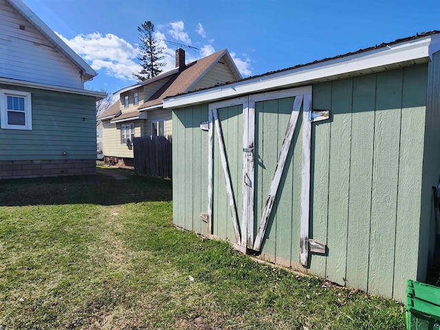 view of shed with fence