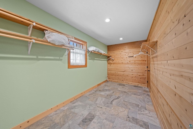 spacious closet with stone finish flooring