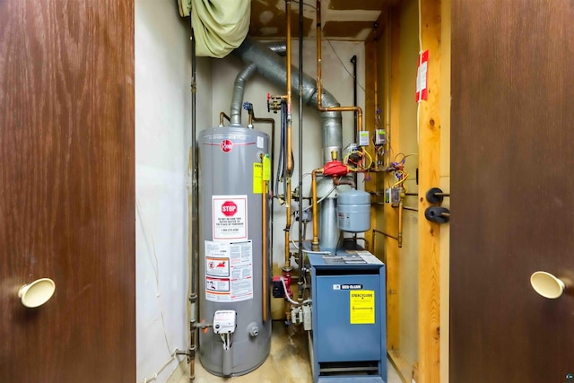 utility room with gas water heater and a heating unit