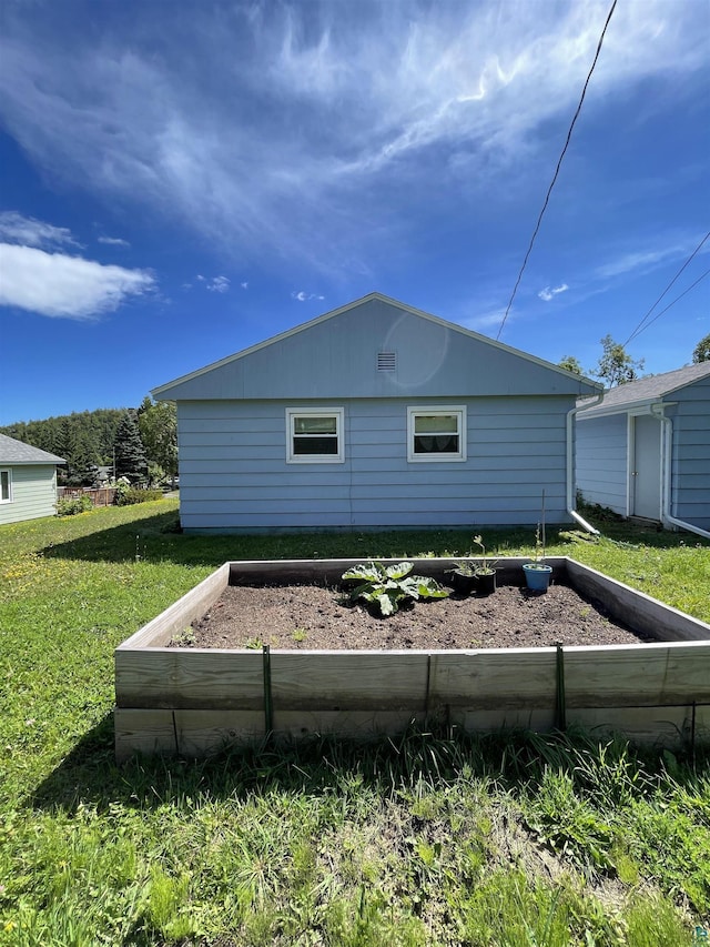 18 Charles Crk, Silver Bay, MN 55614 - view of side of property with a lawn and a garden