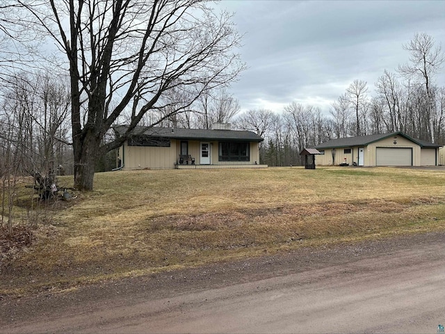 3824 Rehbein Rd, Duluth, MN 55803 - view of front facade featuring an outdoor structure and a front lawn